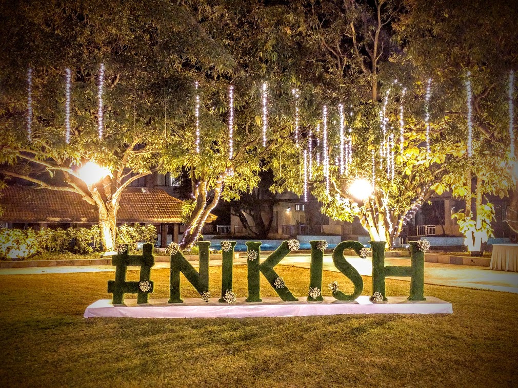 "Nikish Sign Under the Tree"